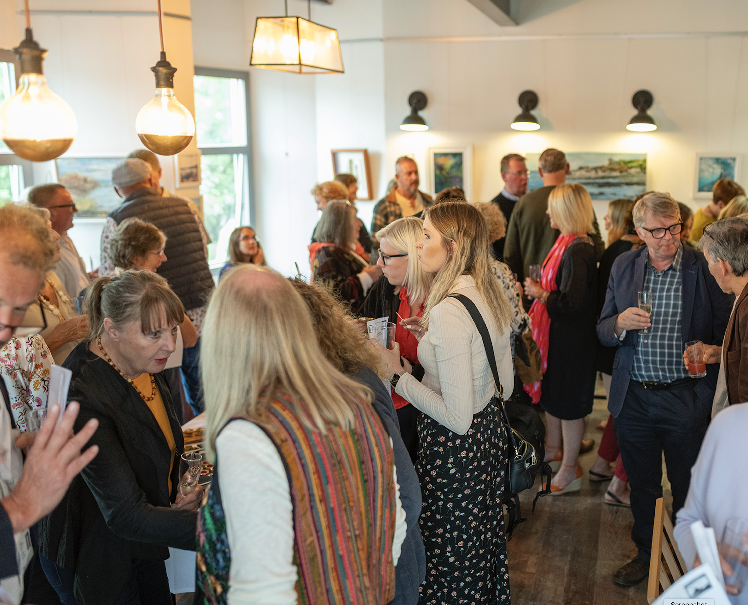 photograph of a crowded art gallery